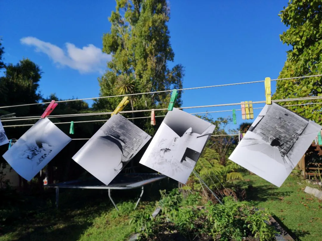Paper negatives drying on the line
